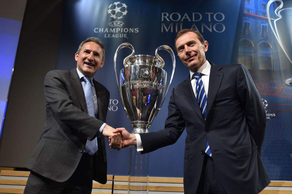 Txiki Begiristain (left) shakes hands with Emilio Butragueno of Real Madrid