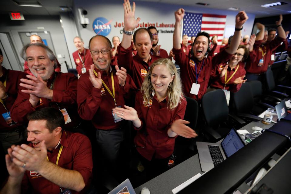  Nasa engineers celebrate after the InSight lander touched down on Mars