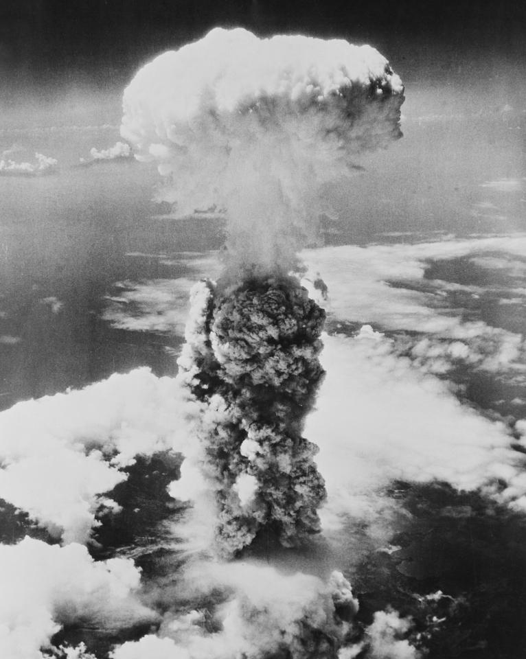 A giant mushroom cloud rises over Hiroshima after an atomic bomb razed the city on August 6, 1945