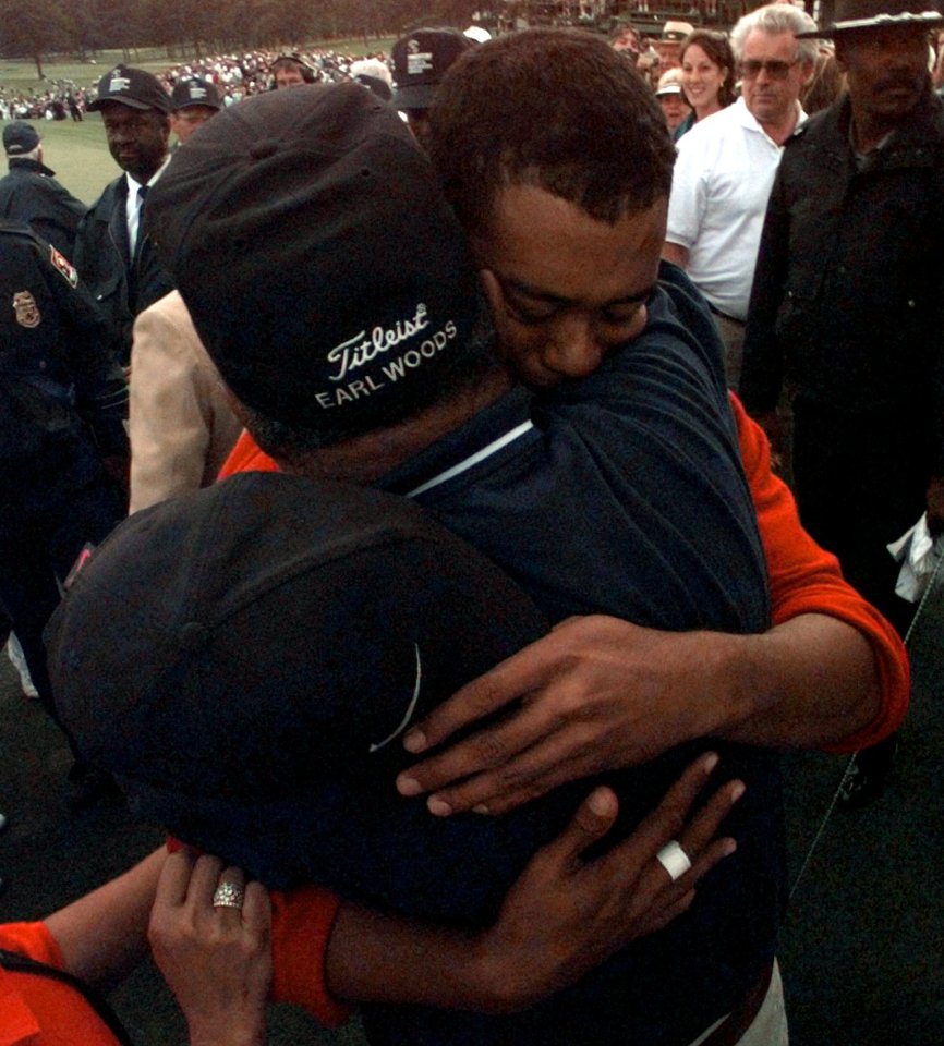  Woods hugs dad Earl after his legendary win at the 1997 Masters
