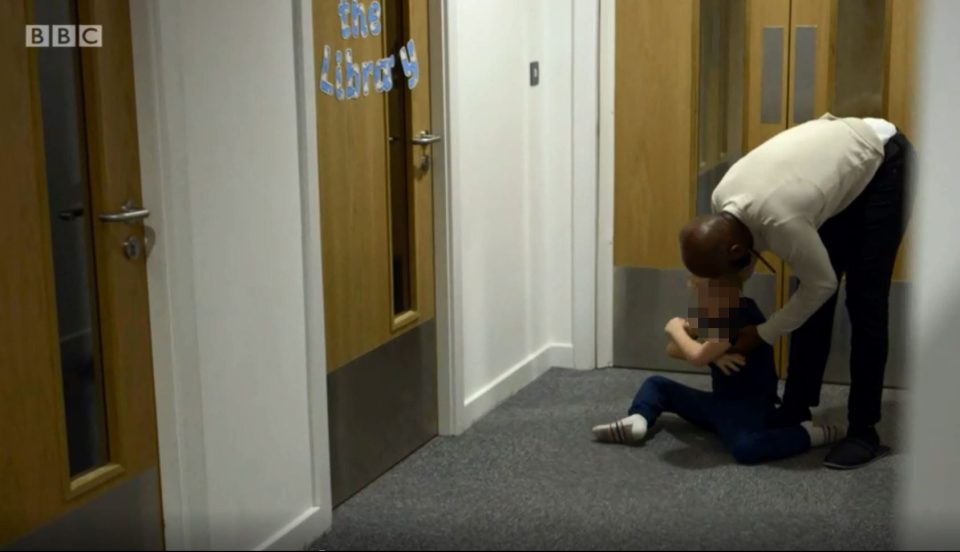  Footage captured by the BBC last year shows a staff member supporting a little boy who is acting up