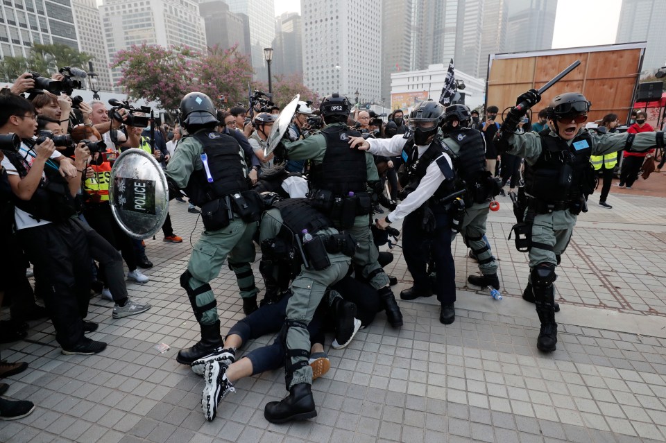 Riot police clash with protesters during a Uighur demonstration in Hong Kong