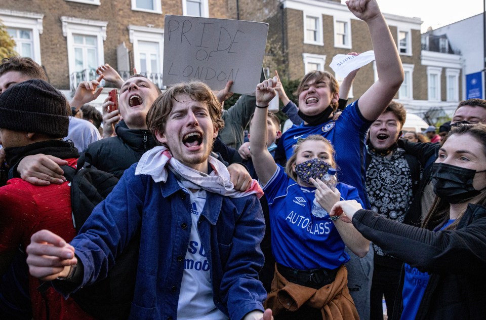 Chelsea fans celebrating the decision to quit the Super League