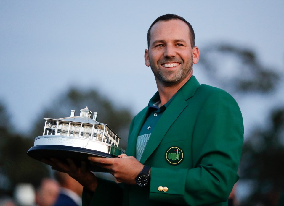 Sergio Garcia holding the Masters Tournament trophy in a green jacket.