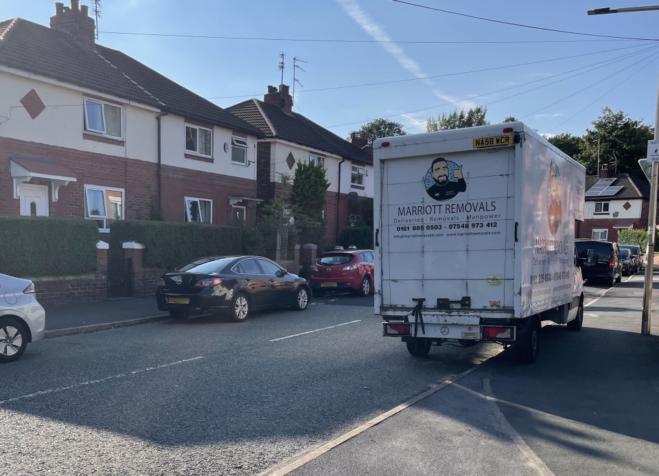 One of the Marriott Removals vans parked where the complaint arose in Stockport
