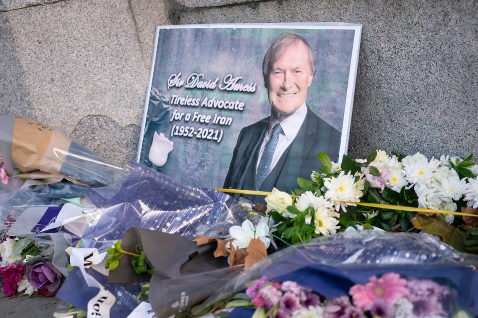Flowers left in memory of Sir David Amess outside the Houses of Parliament in London