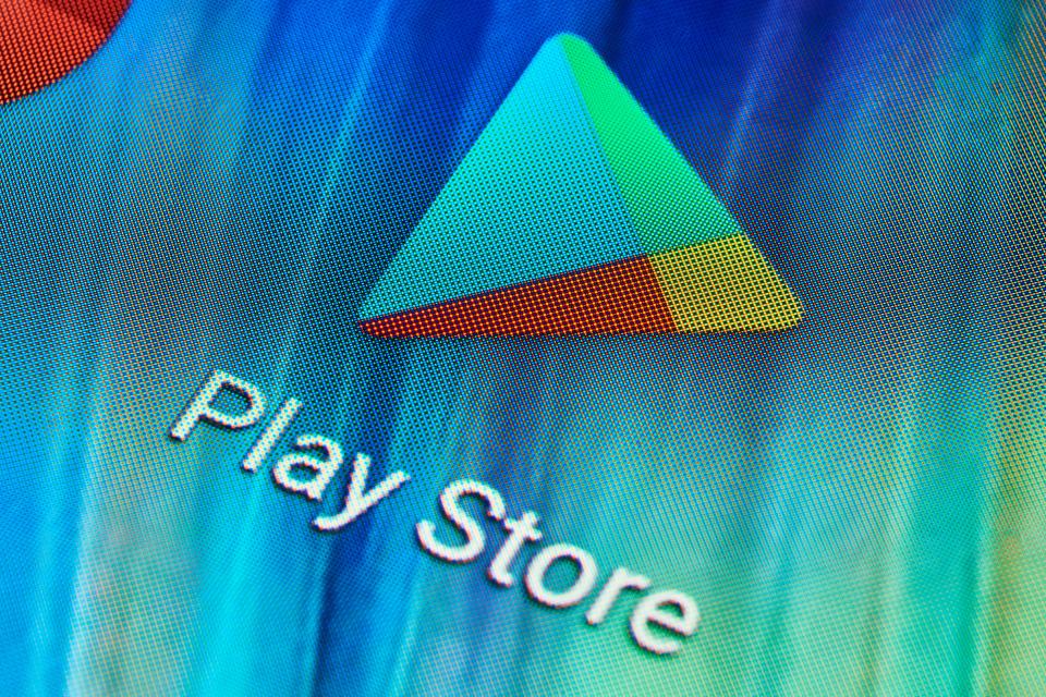 the play store logo is displayed on a colorful background