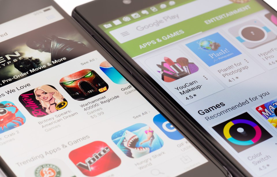 Close-up of Google Play Store and Apple App Store on smartphones.