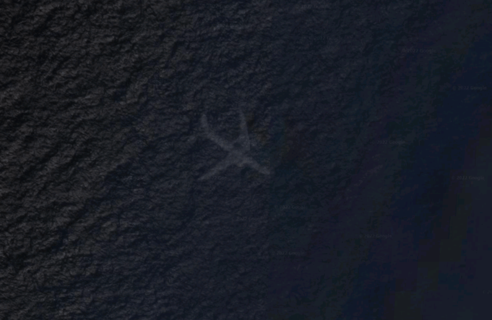 Outline of a plane looks like it's under the ocean