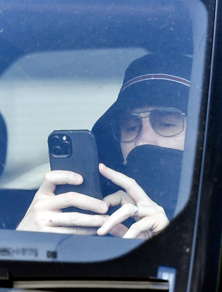 Freddie covering his face while out with his wife last month