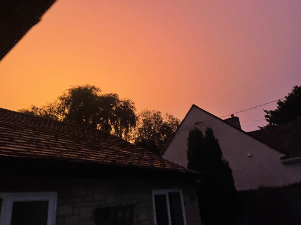 Locals uploaded photos of the curious orange glow