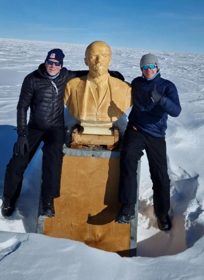 Chris, 62, (left) and his son, Mika, 28, posing alongside the bust