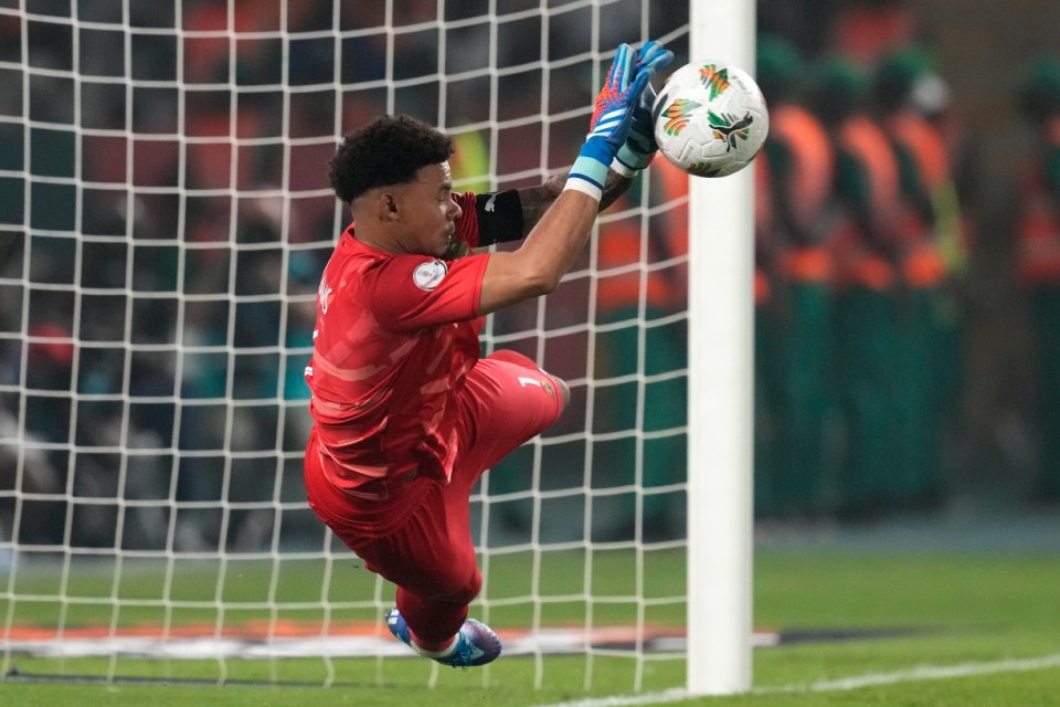 South Africa's goalkeeper Ronwen Williams saves a penalty from Cape Verde's Willy Semedo during a penalty shootout at the end of the African Cup of Nations quarter final soccer match between Cape Verde and South Africa, at the Charles Konan Banny stadium in Yamoussoukro, Ivory Coast, Saturday, Feb. 3, 2024. (AP Photo/Themba Hadebe)