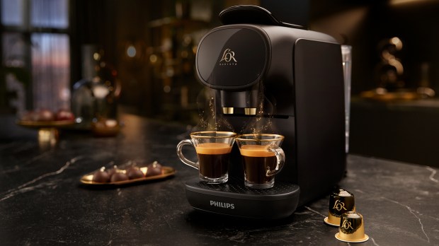 Philips Barista espresso machine making two cups of coffee.