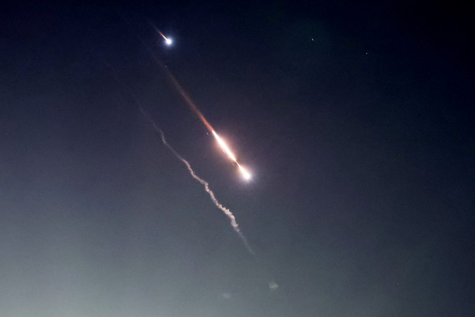 Objects are seen in the sky above Jerusalem after Iran launched drones and missiles towards Israel, in Jerusalem April 14, 2024. REUTERS/Ronen Zvulun TPX IMAGES OF THE DAY