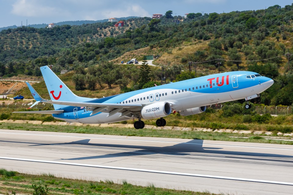 Skiathos, Greece  August 2, 2019: TUI Boeing 737-800 airplane at Skiathos airport (JSI) in Greece. Boeing is an American aircraft manufacturer headquartered in Chicago.