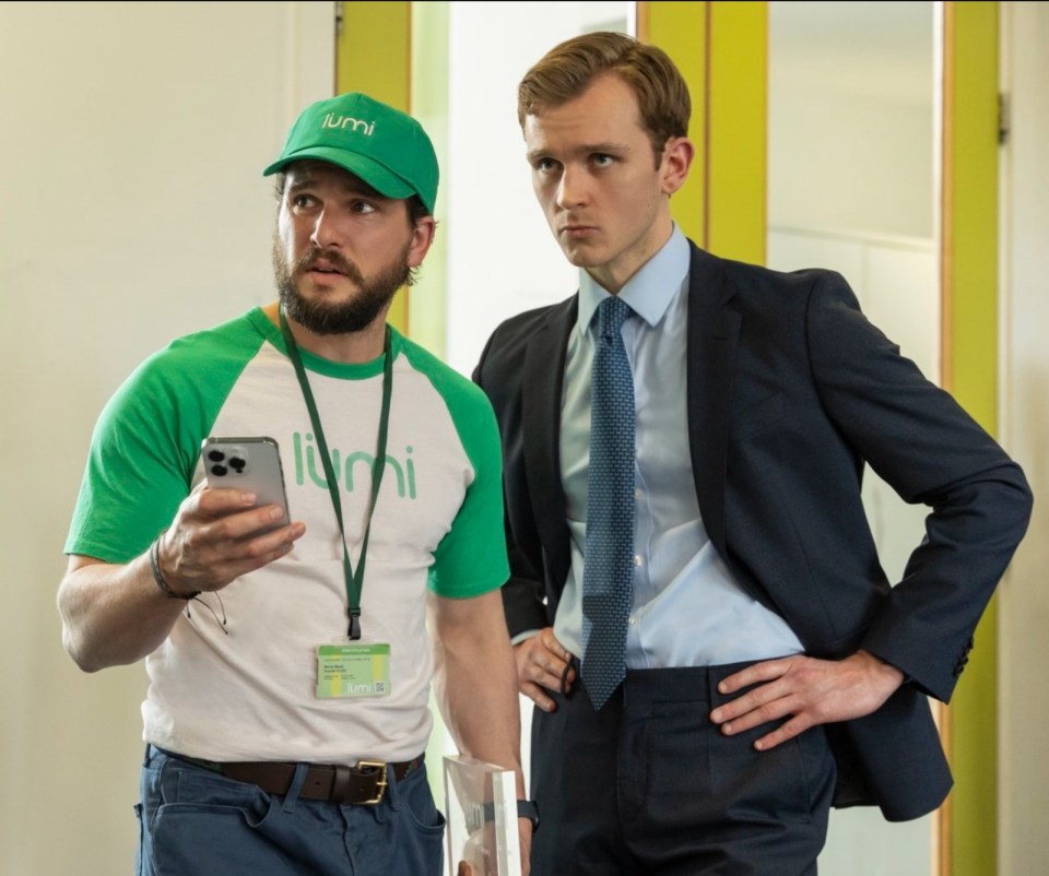 a man wearing a green hat that says lumi on it