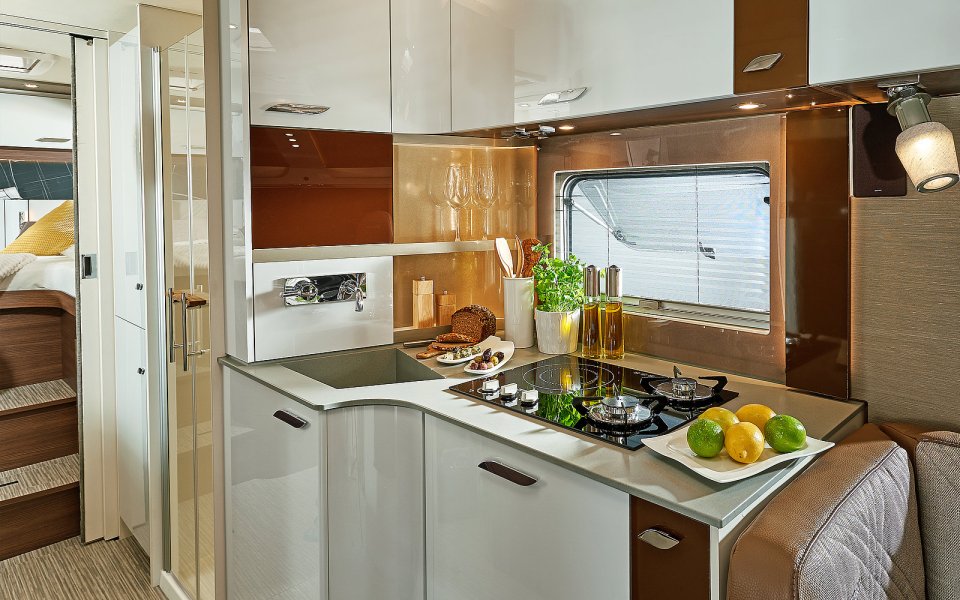 a kitchen with white cabinets and a stove top oven