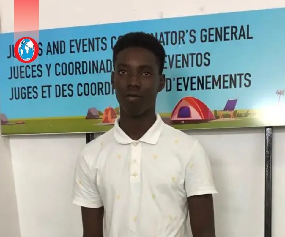 a young man with braids is wearing a black shirt