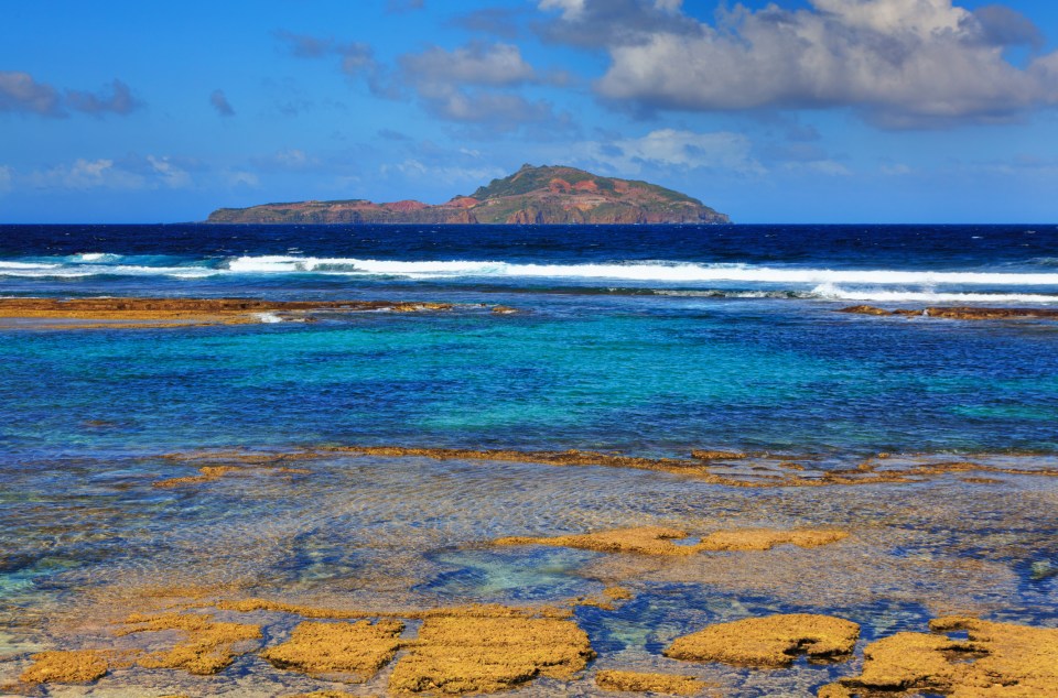 a small island in the middle of the ocean