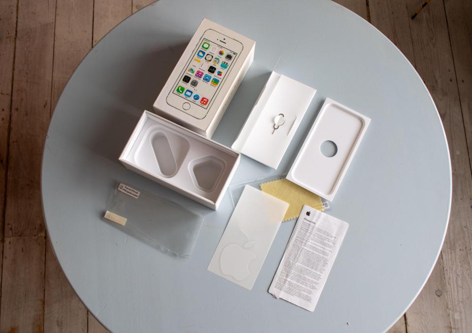 a white box with an iphone inside of it
