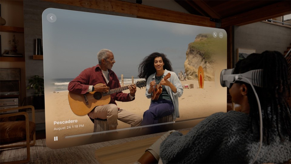 a woman wearing a virtual reality headset is watching a video of pescadero