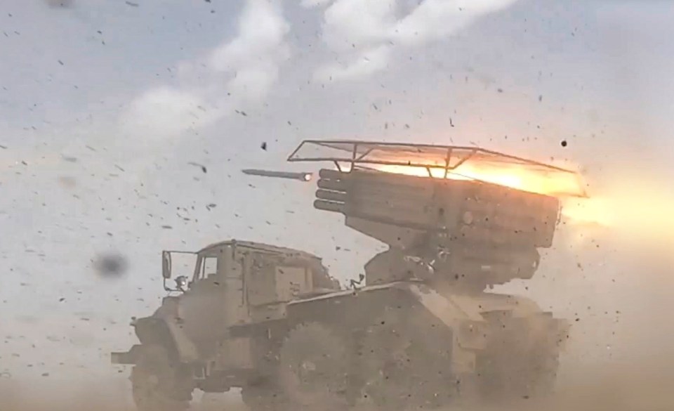 a military vehicle with a rocket coming out of it