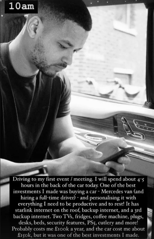 a black and white photo of steven looking at his phone