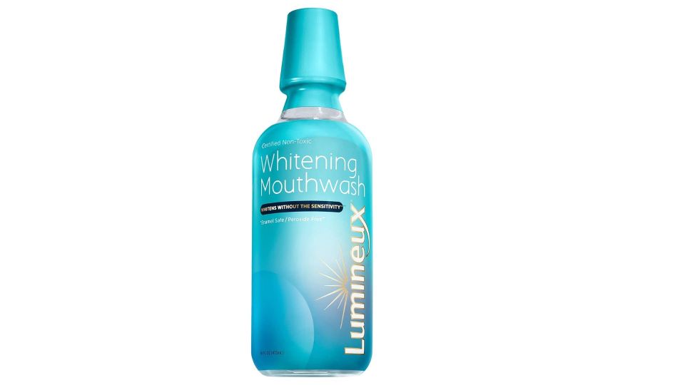a blue bottle of lumineux whitening mouthwash