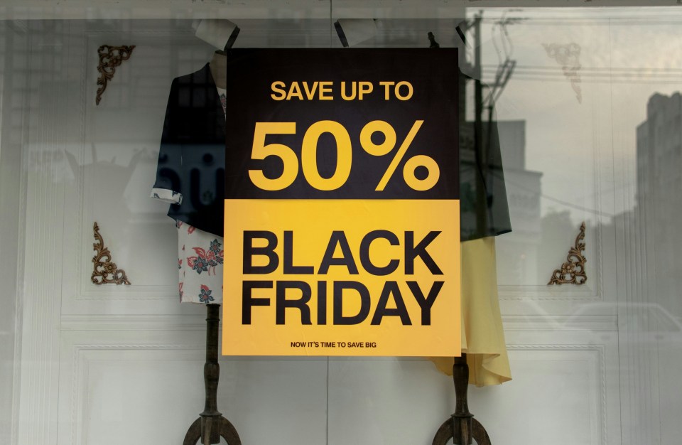 a sign that says save up to 50% black friday