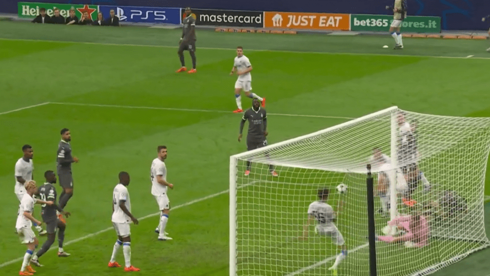 a soccer game is being played on a field sponsored by mastercard and heineken