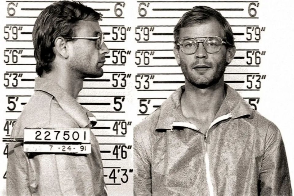 a man with glasses and a tag that says 22750i
