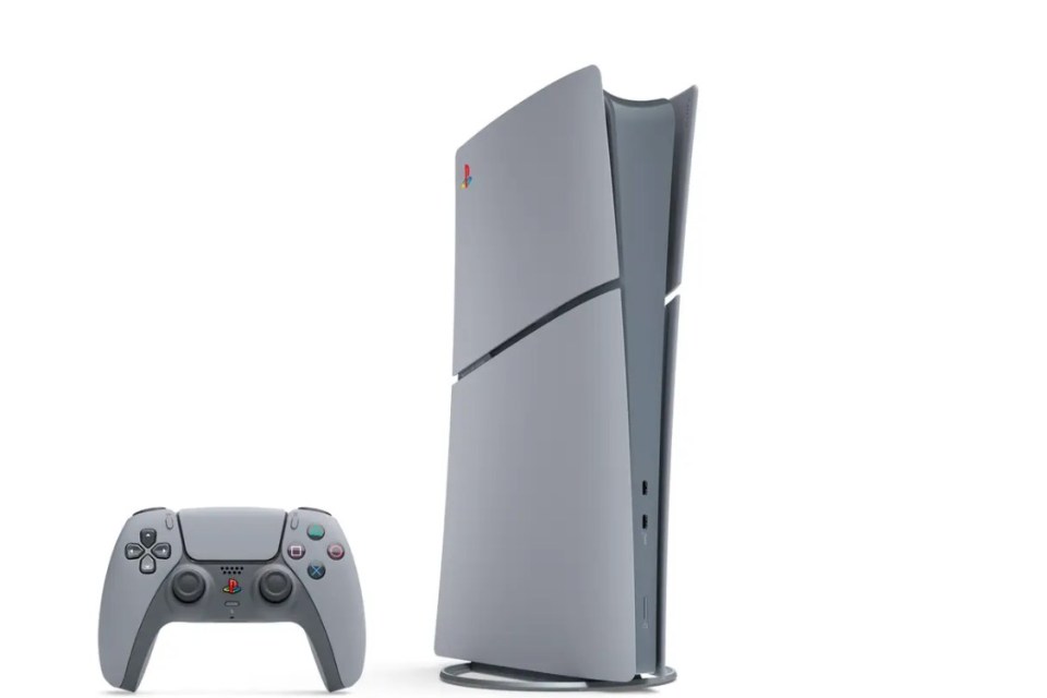 a playstation controller is next to a playstation console