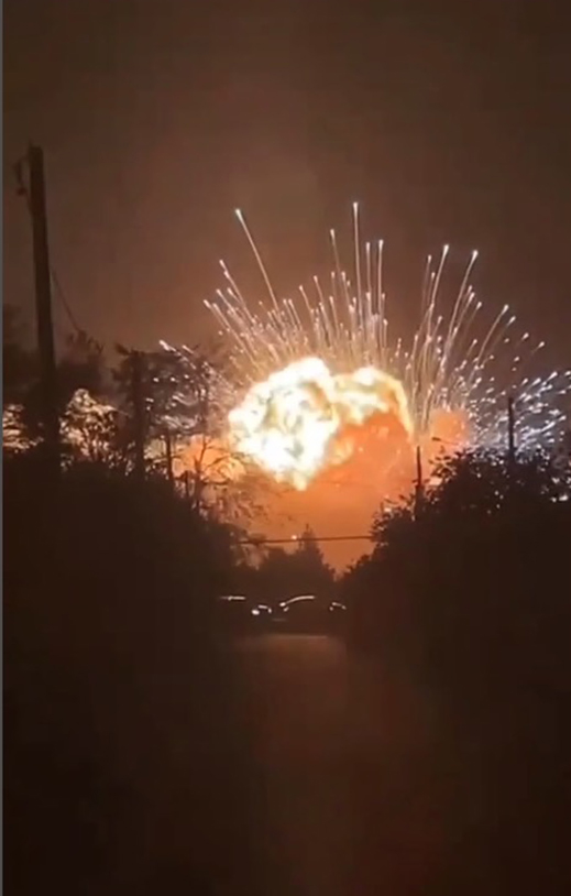 a large fireworks display is going off in the night sky