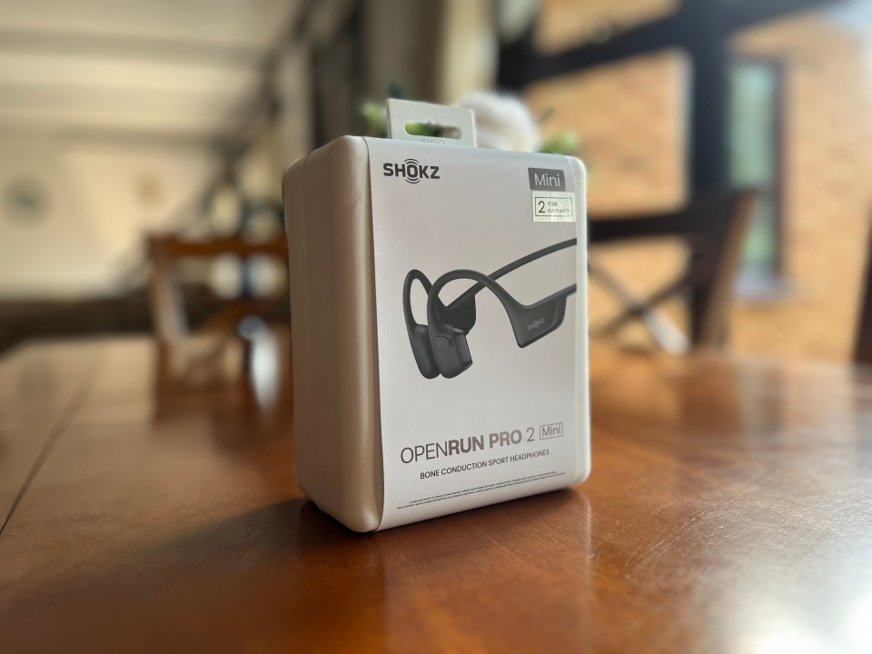The box of the Shokz OpenRun Pro 2 sits on a wooden table