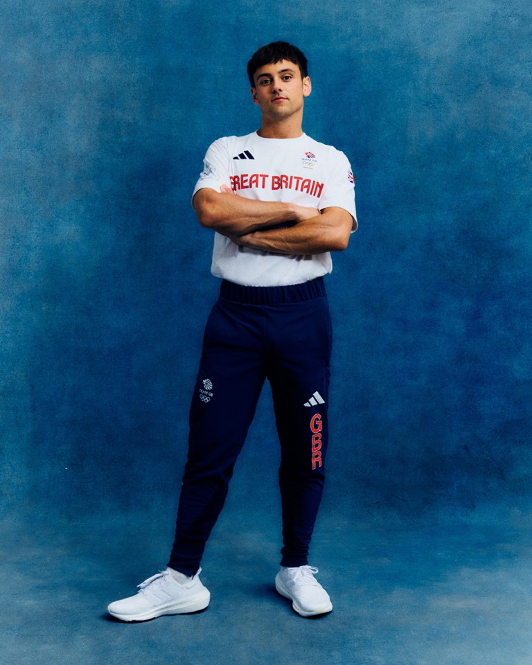 a man wearing a white shirt that says great britain