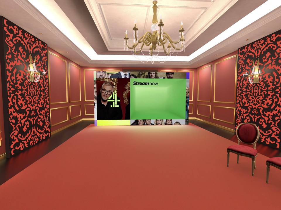 a room with a green screen that says stream now
