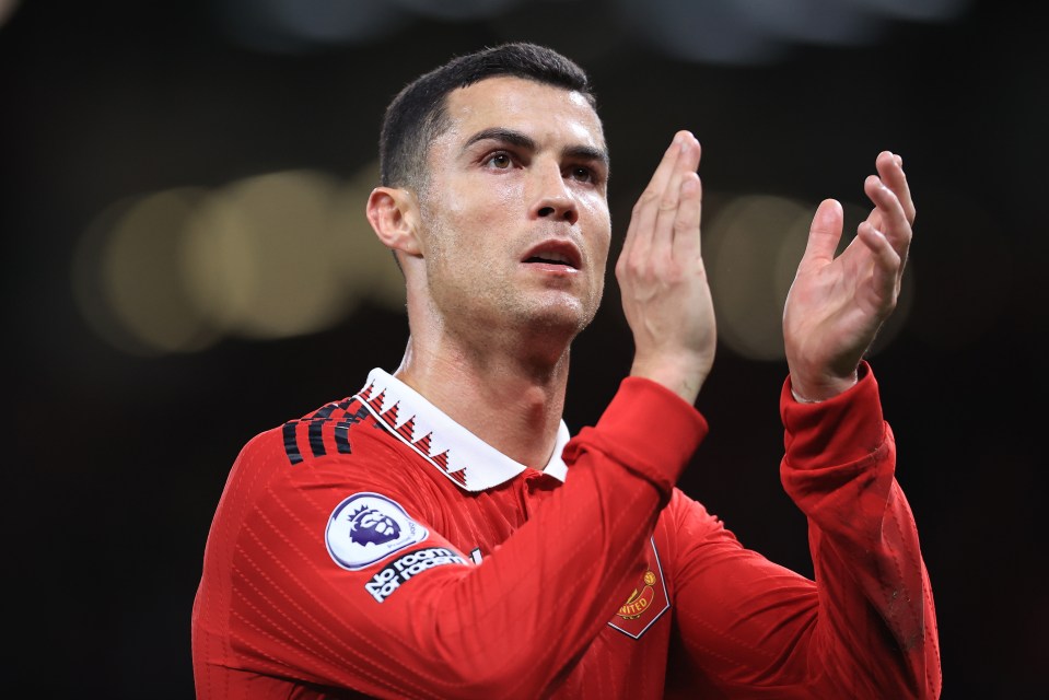 a man wearing a red jersey with the word manchester on it