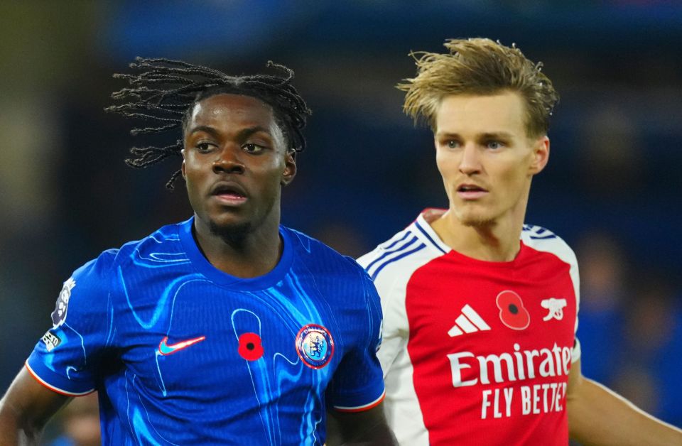 two soccer players wearing emirates fly better shirts