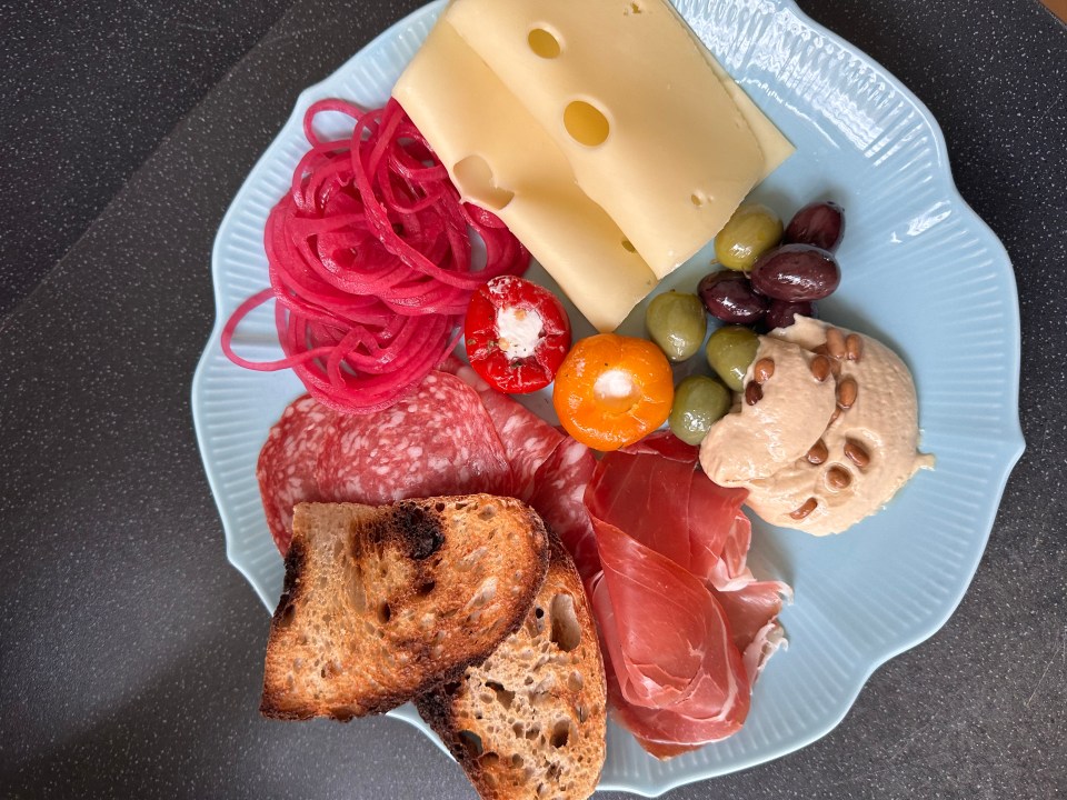 a blue plate with a variety of food on it
