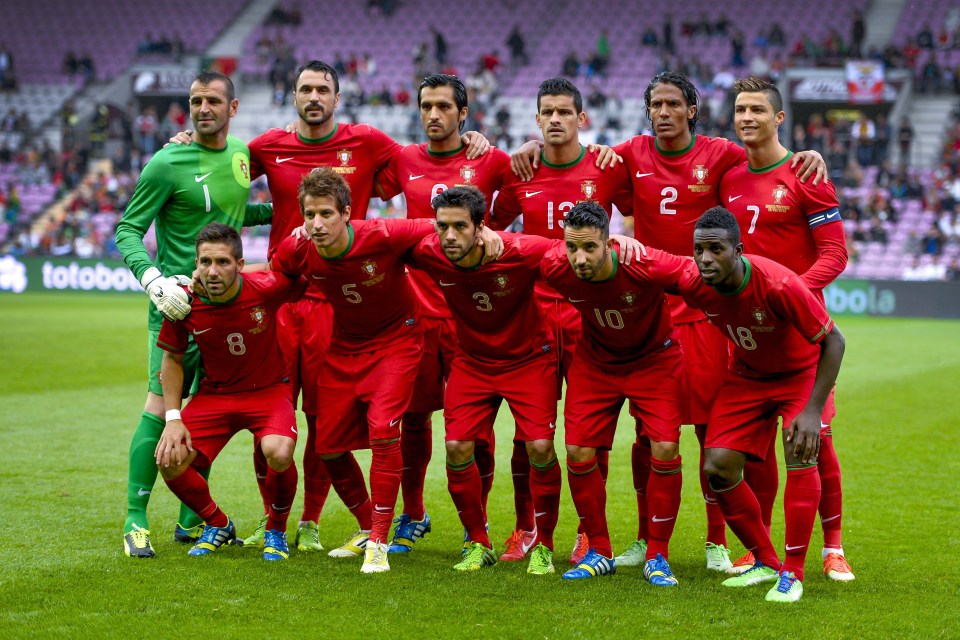 a group of soccer players posing for a photo with one wearing the number 10