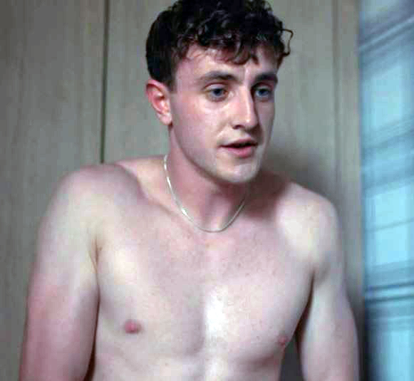 a shirtless man wearing a chain around his neck