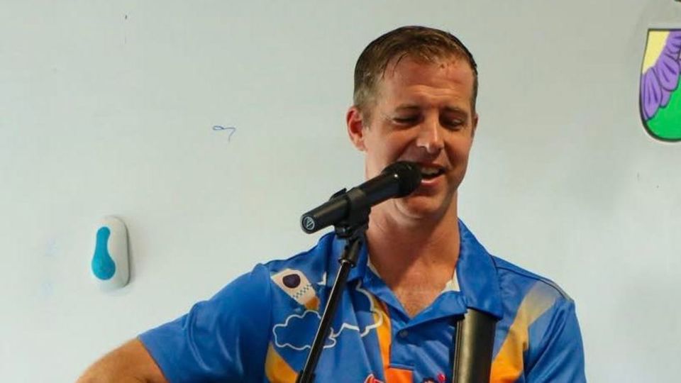 Man singing into a microphone.
