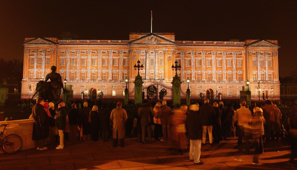 Buckingham Palace illuminated with artwork for a Christmas celebration.