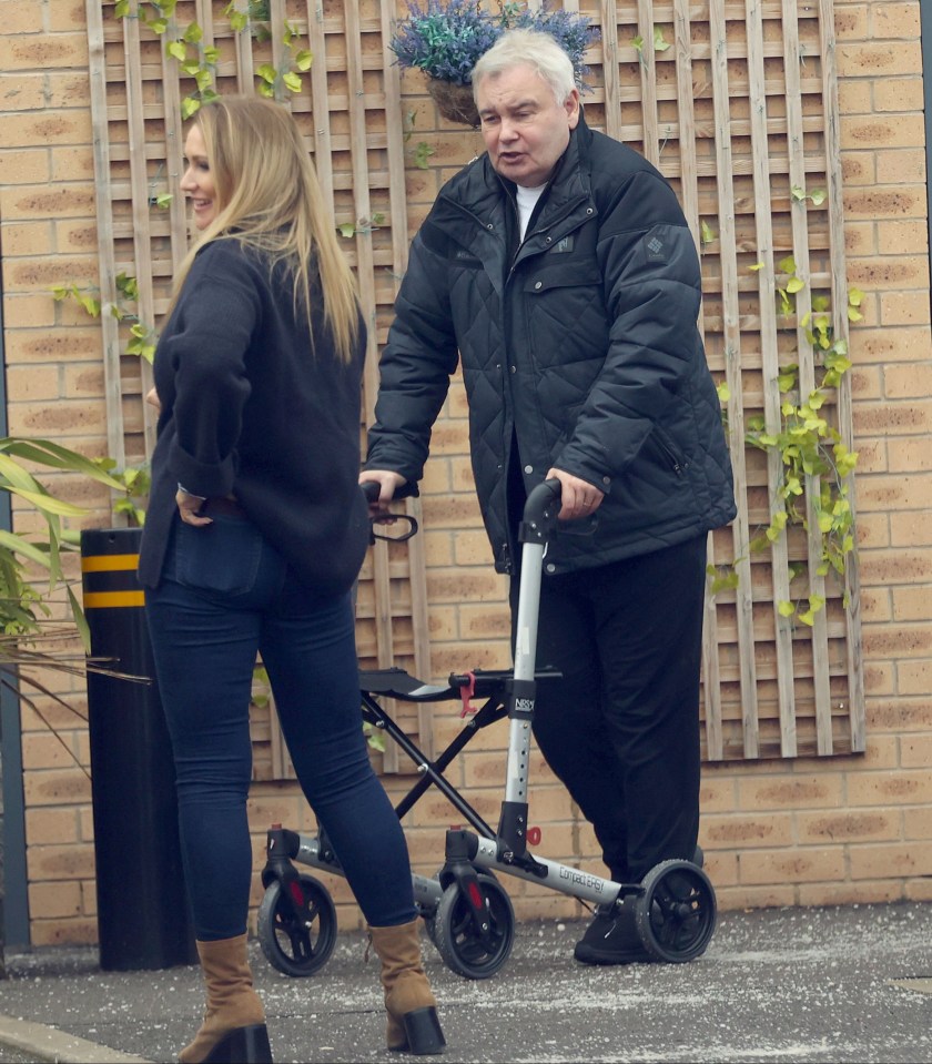 Kate and Eamon Holme with a friend, Eamon using a walker.