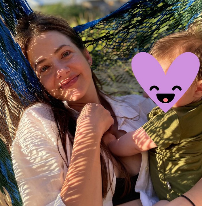 Actress Julie Gonstavlos with her baby in a hammock.