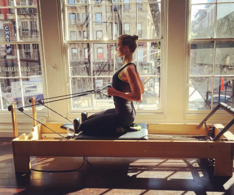 Karlie Kloss doing Pilates.