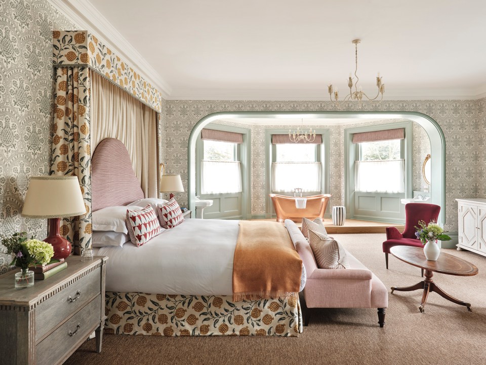 Bedroom at the Retreat at Elcot Park with a copper bathtub.