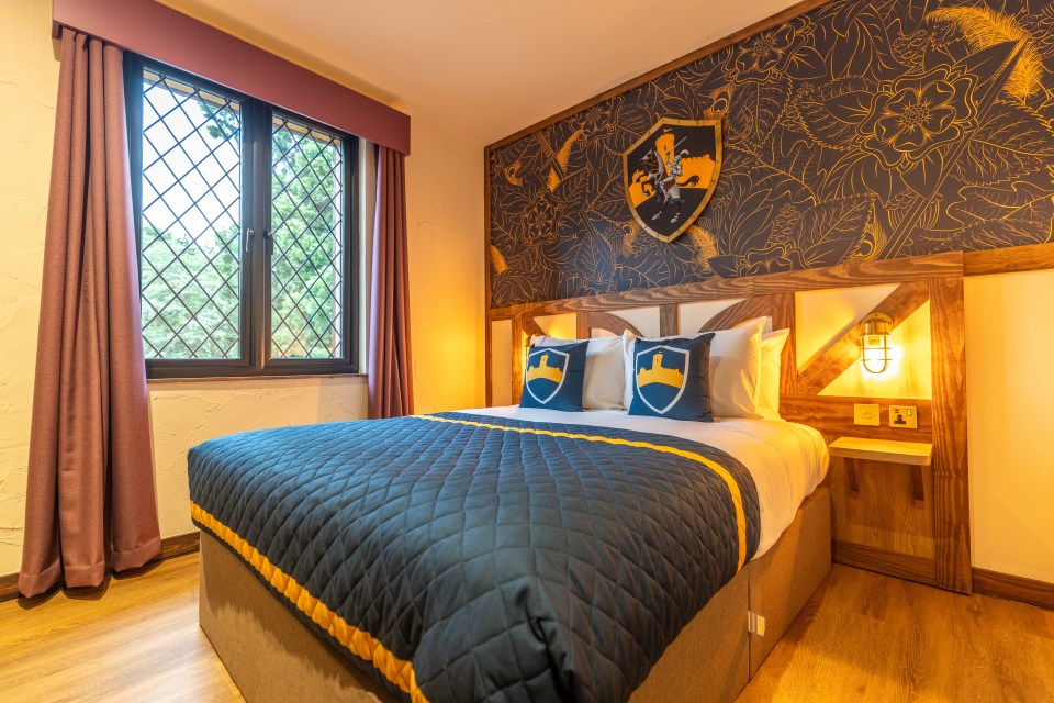 Warwick Castle hotel room with a knight-themed bed.