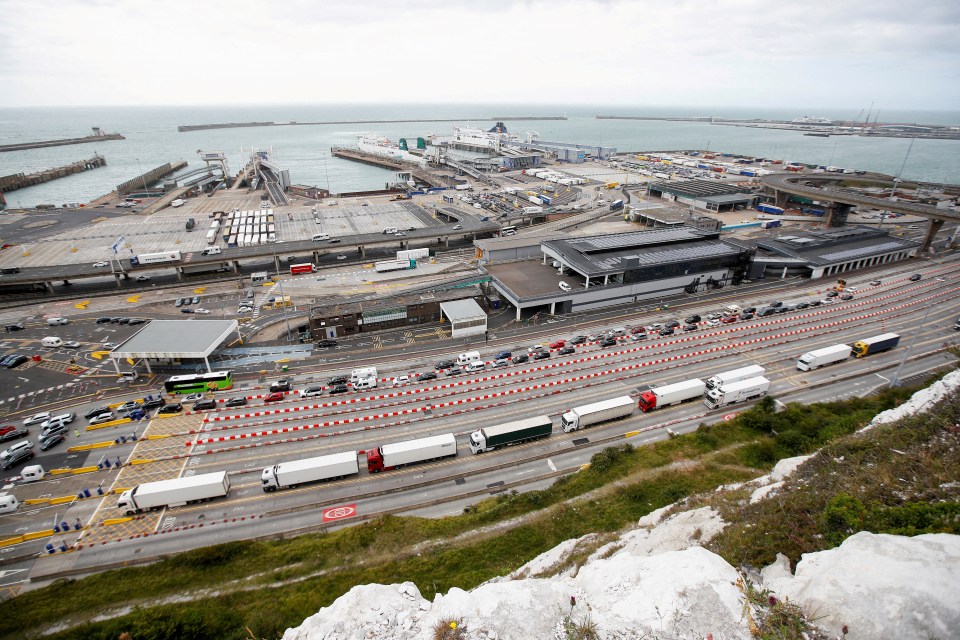Vehicles queueing at border control booths in Dover.
